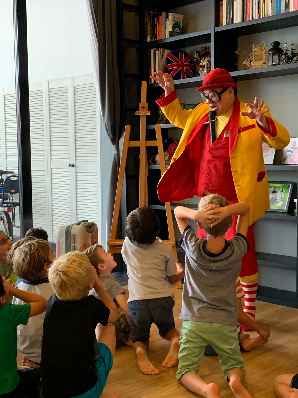 Maddie performing a live magic show for children at a Singapore birthday party